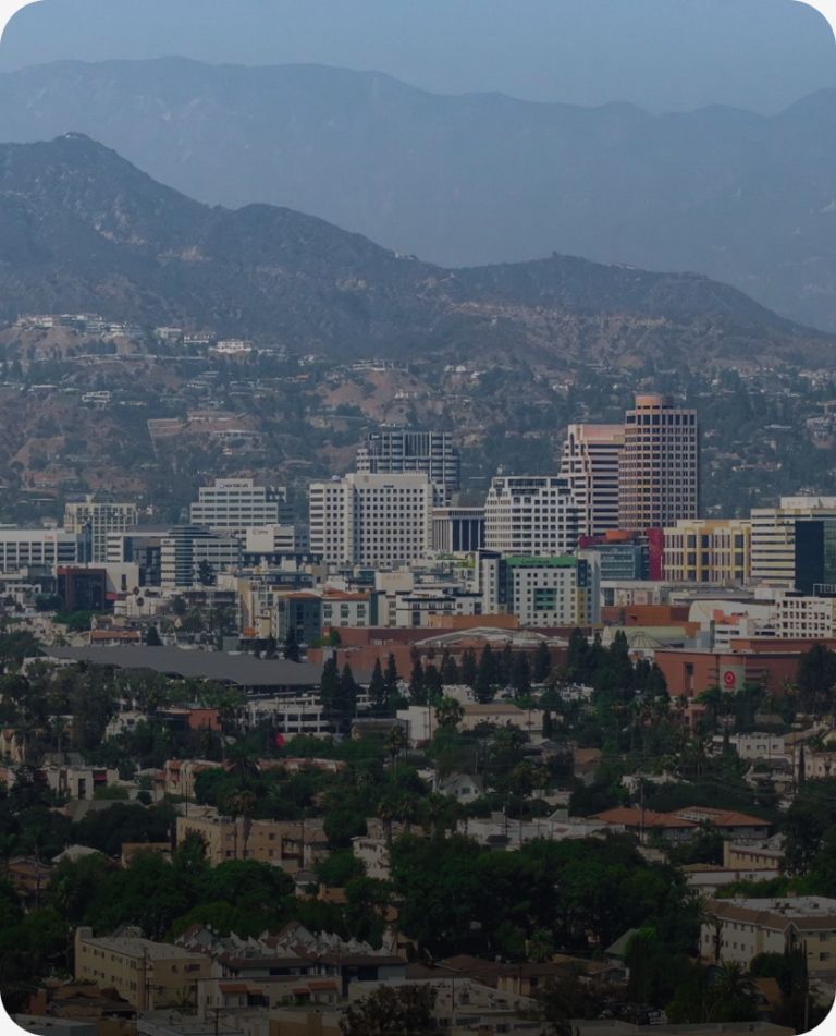 Downtown Glendale from above, with the mountains behind, in the Los Angeles County market served by Peninsula CRE Group