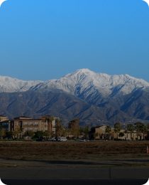 Snow-capped mountains above Rancho Cucamonga, in the Inland Empire market served by Peninsula CRE Group